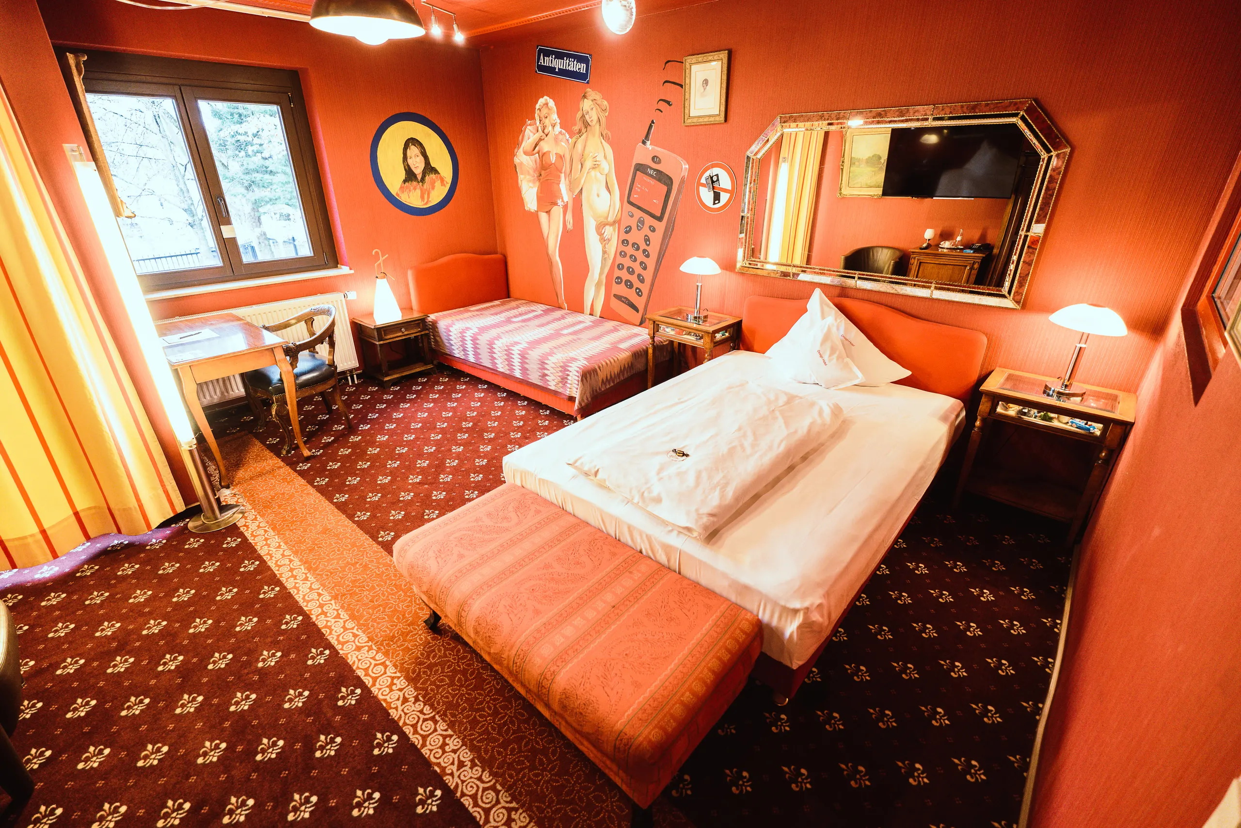 A bed combination featuring a double bed and a single bed in the “Trend” themed room.